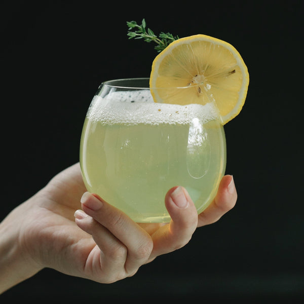 Hand holding a refreshing drink.