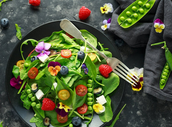 Colorful salad with edible flowers