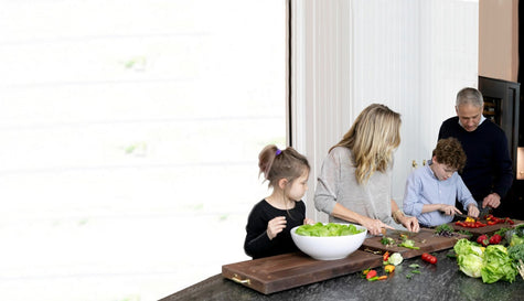 Family cooking together in kitchen