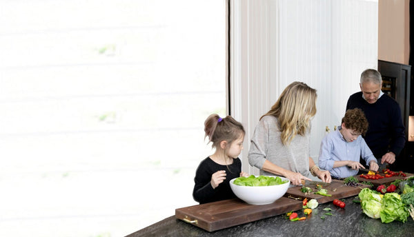Family cooking together in kitchen