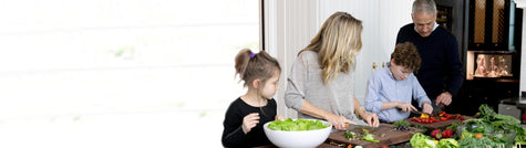 Family cooking together in kitchen
