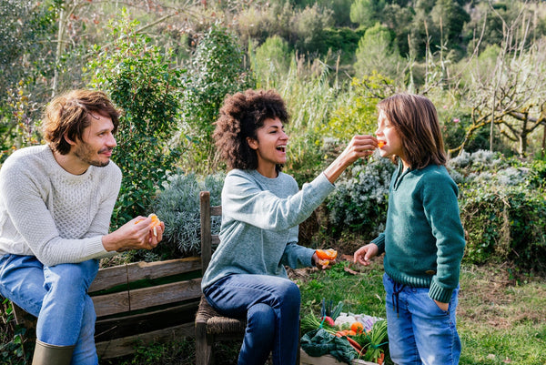 Family enjoying fresh food outdoors