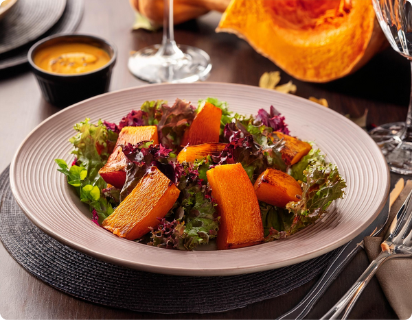 Roasted pumpkin salad on table