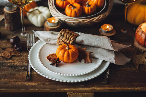 Autumnal table setting with pumpkins